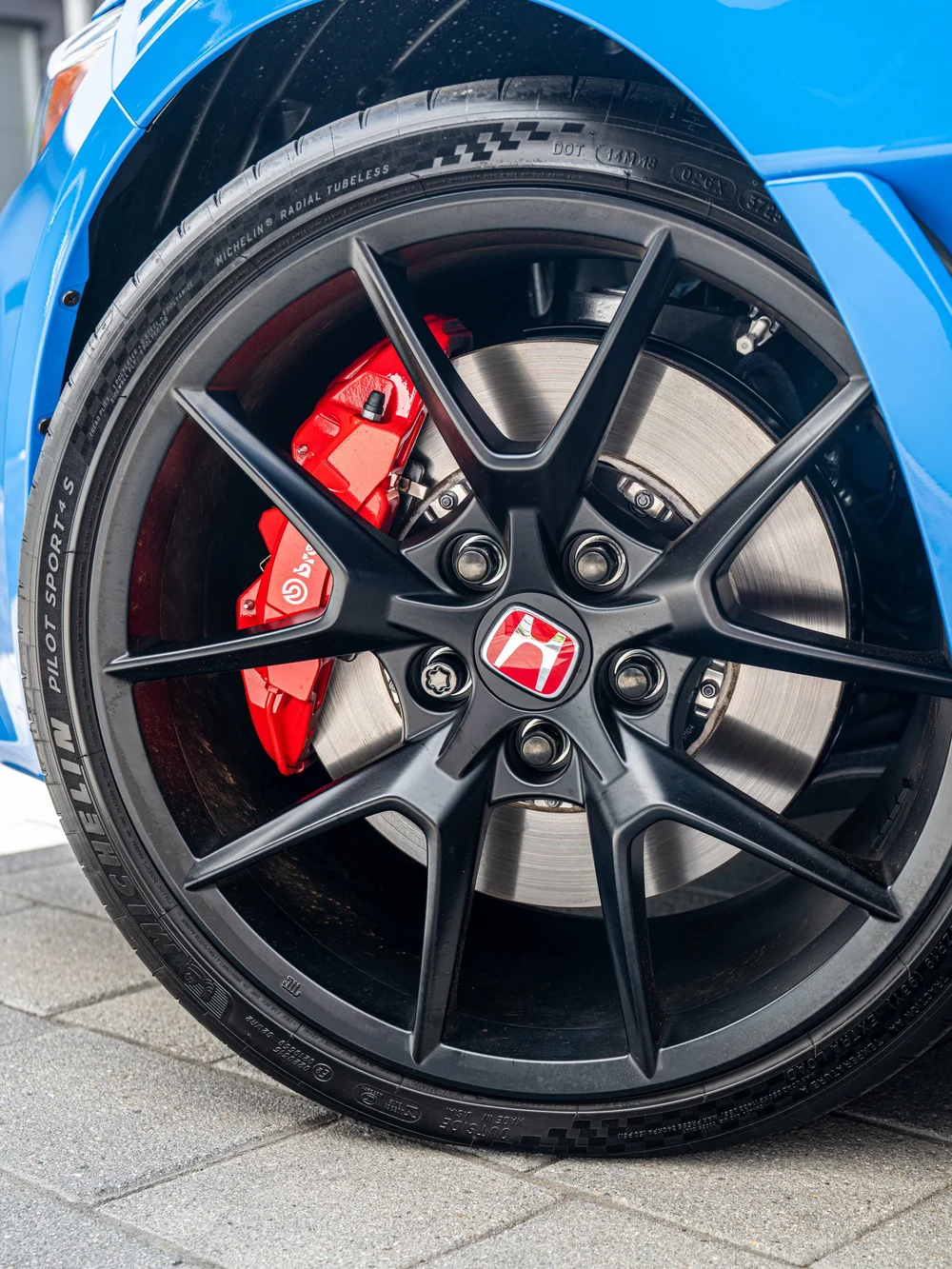 Black front wheel and red brake caliper on a 2026 Honda Civic Type R FL5