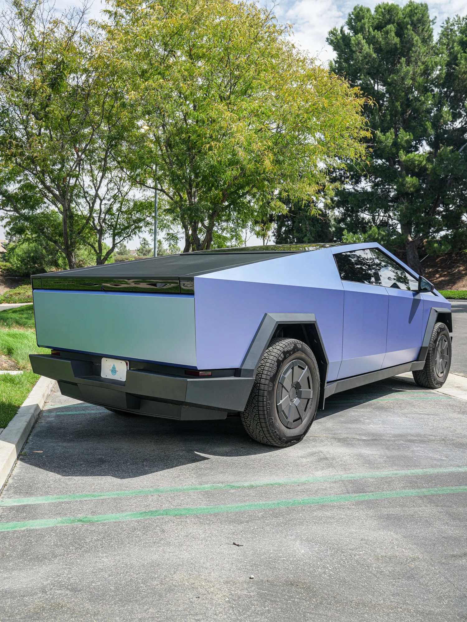 Tesla Cybertruck Matte Blue after Vinyl Wrap, rear-left three-quarter view