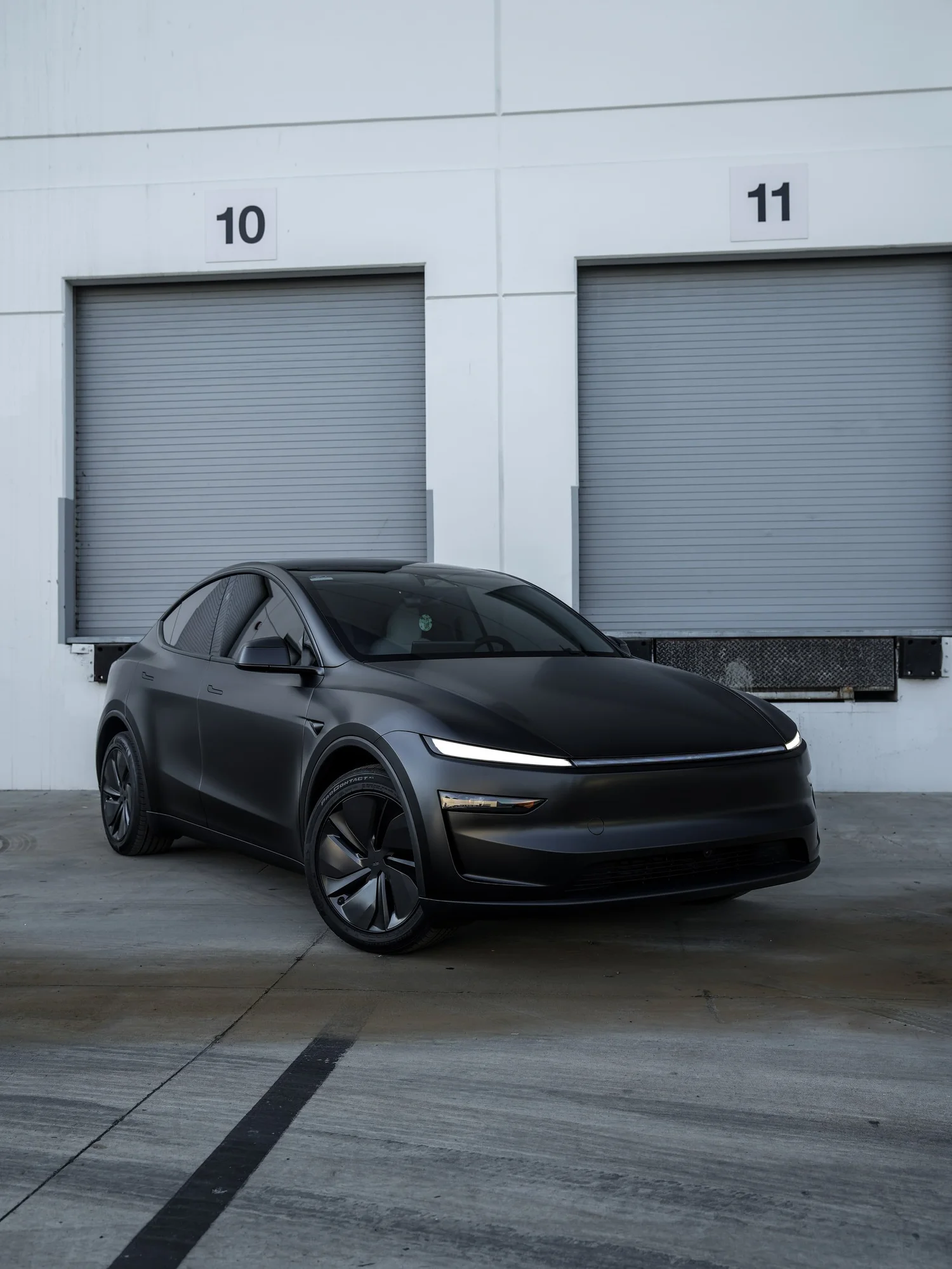 Tesla Model Y 3M Satin Black after Vinyl Wrap, front-right three-quarter view