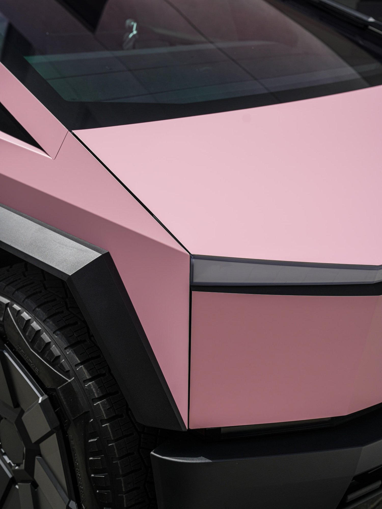Satin Fresh Pink Tesla Cybertruck after Vinyl Wrap, film-edge and surface-finish detail