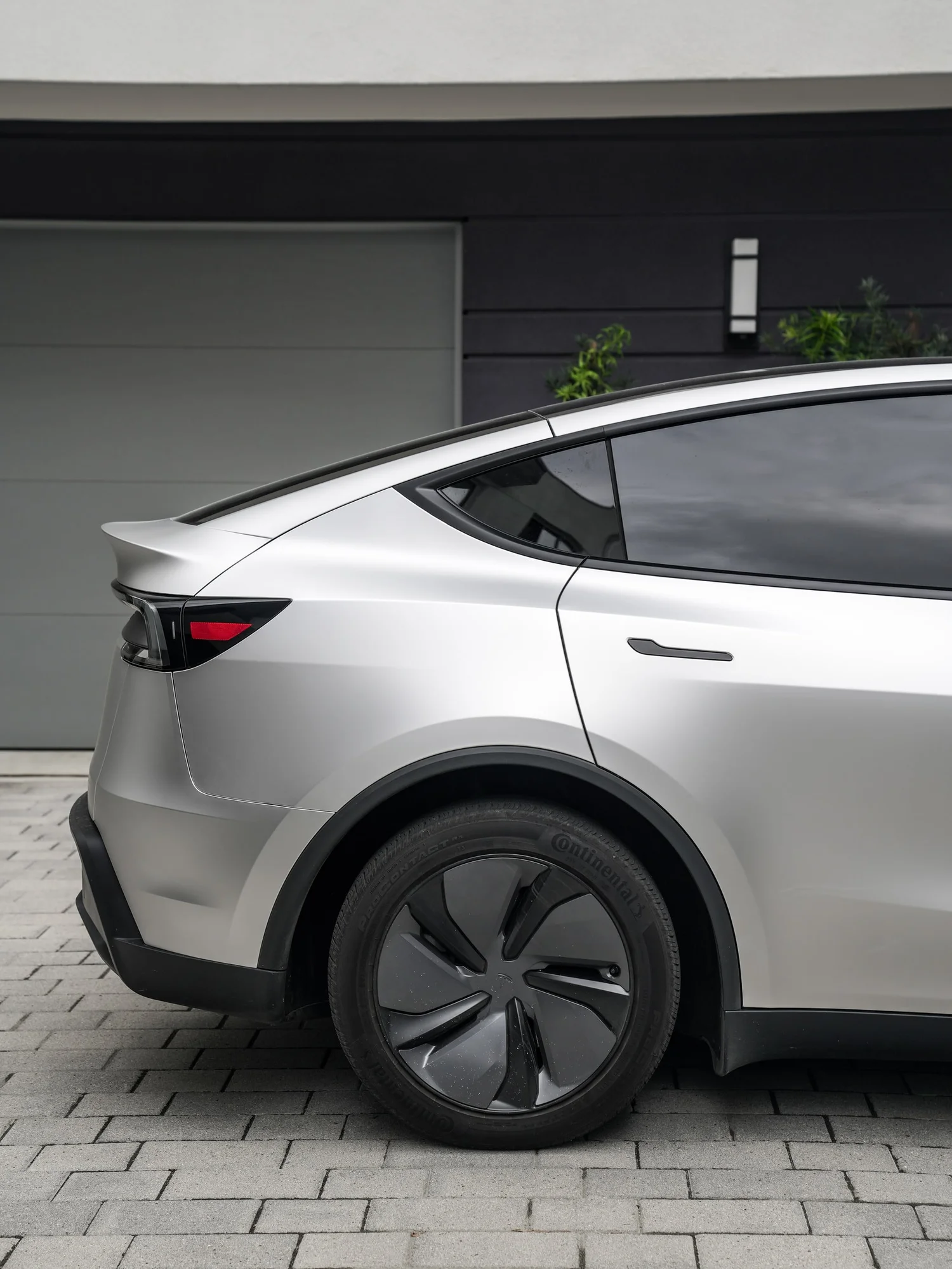 Tesla Model Y TPU Matte Silver Colored PPF after Paint Protection Film (PPF), rear-quarter and wheel view
