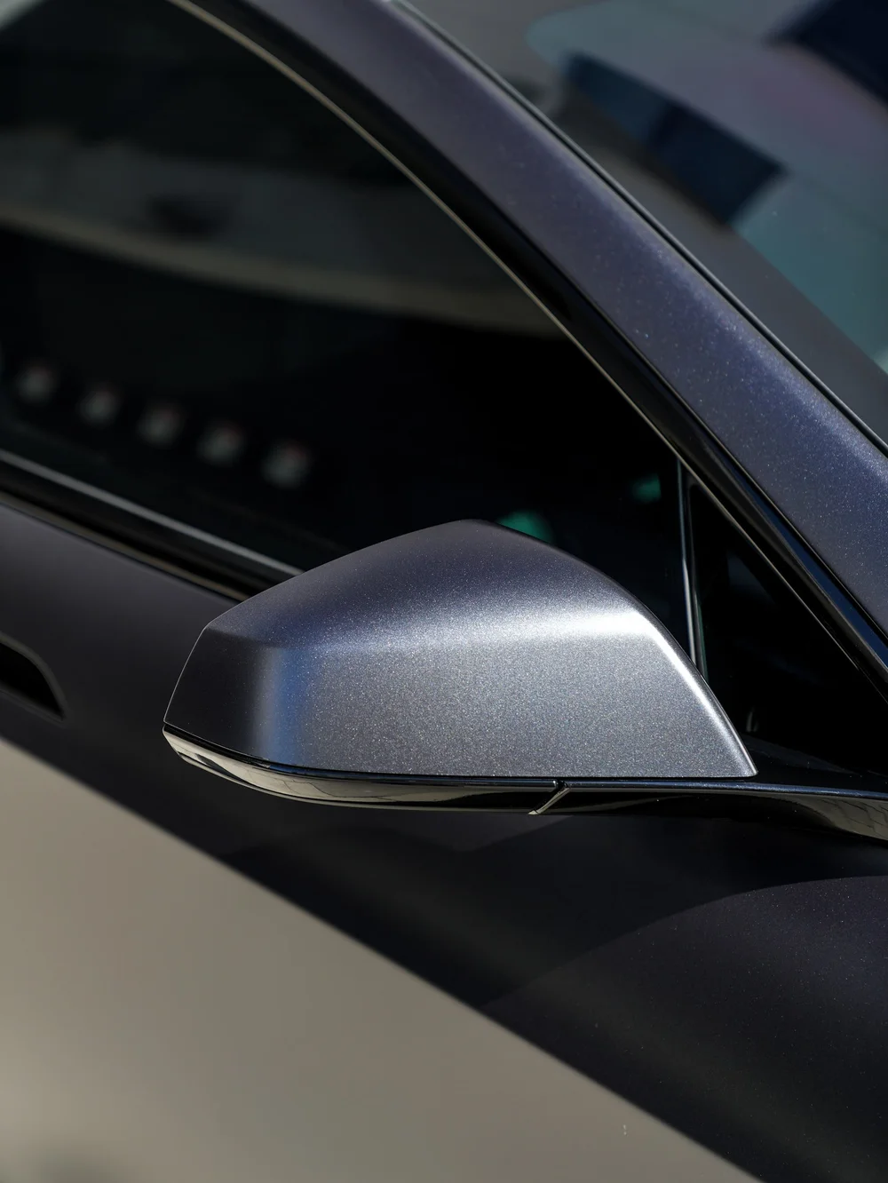 Side mirror and matte body surface close view — Tesla Model S matte PPF and XPEL XR Plus window tint project