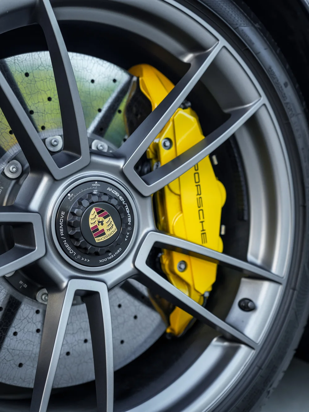 Wheel spokes and yellow brake caliper on the Porsche 911 Turbo S from this protection project