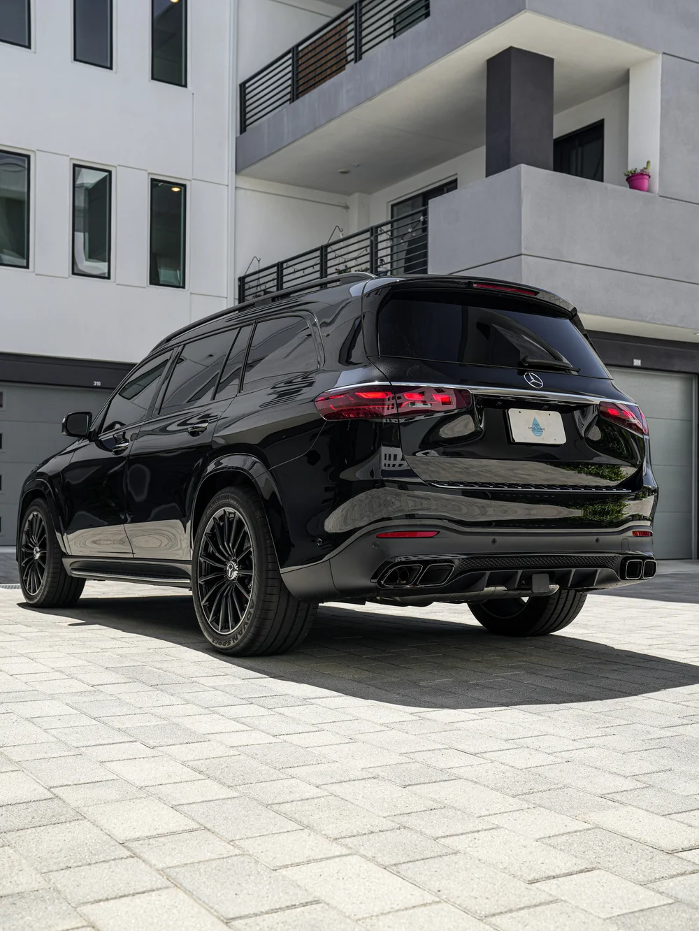 Low rear three-quarter view of the Mercedes-AMG GLS 63 after PPF and XPEL XR Plus window tint