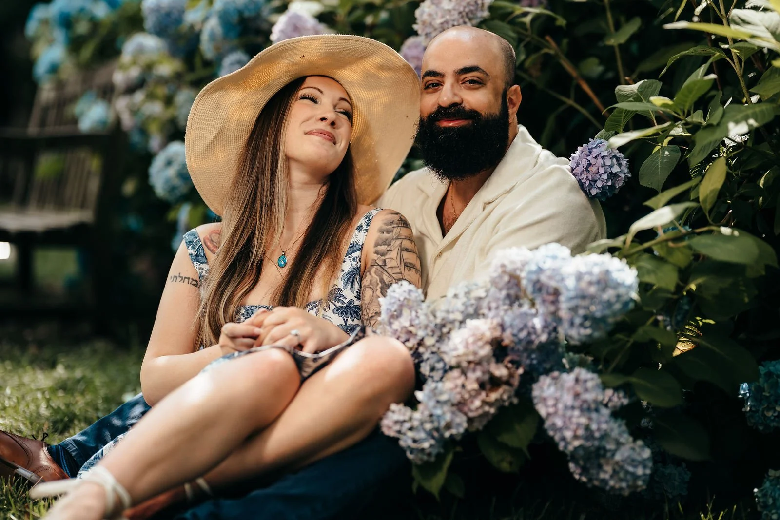 Couple laughing among hydrangeas, Seaport Boston engagement photography