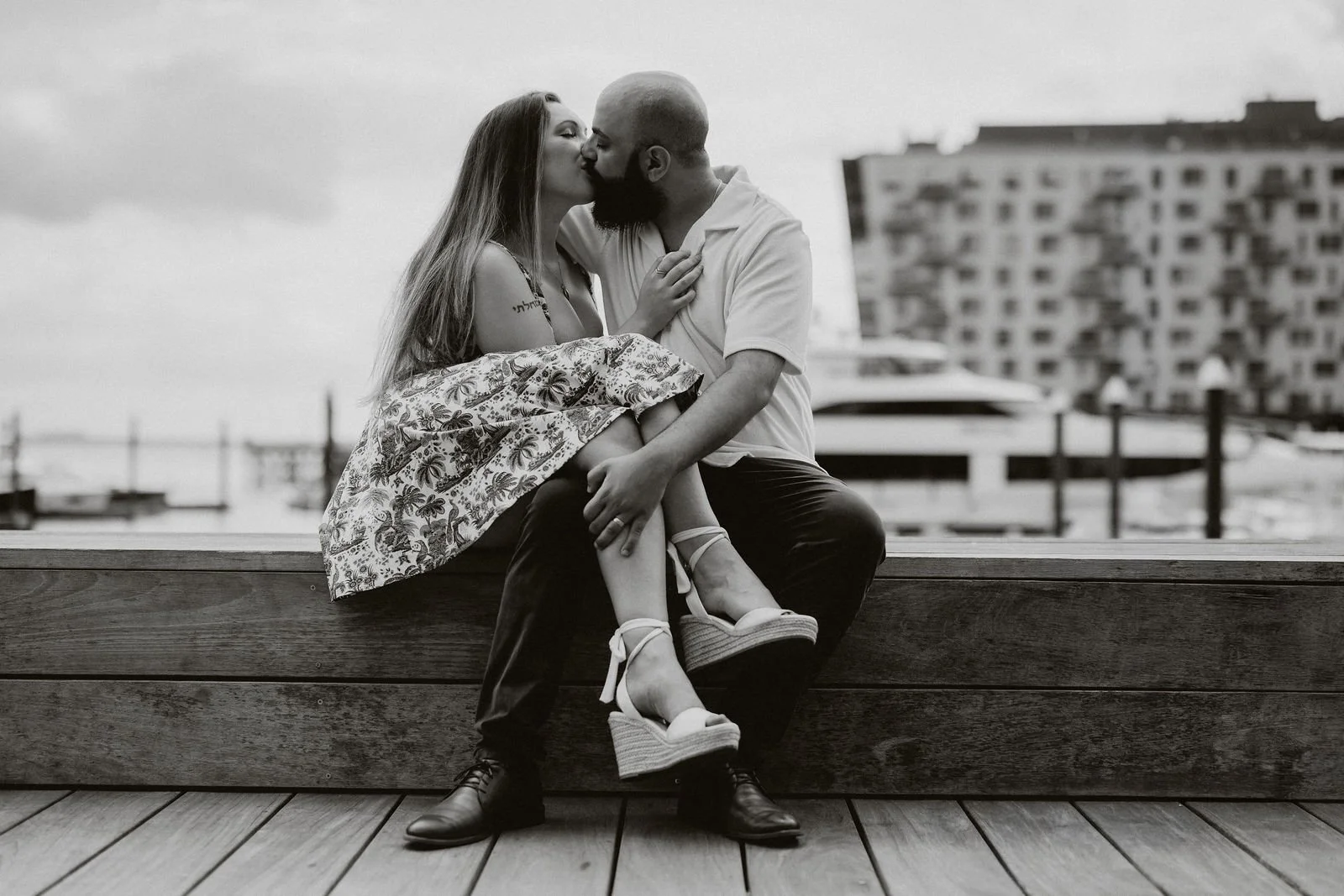 Black and white seated portrait of Aziz and Katherine, Seaport Boston