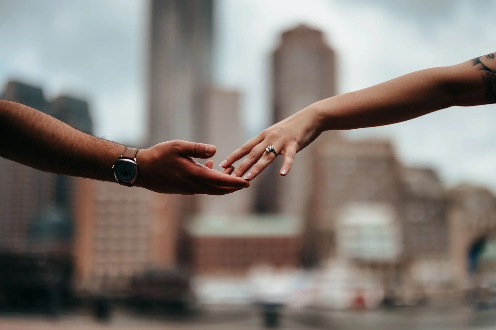 Close-up of Katherine's engagement ring during Seaport Boston engagement photos