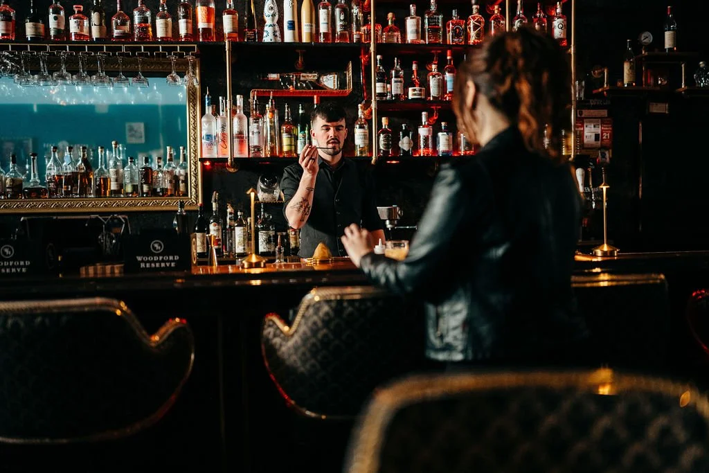 Moody speakeasy atmosphere at The Candy Bar during Kristin and Mike's Laconia engagement session