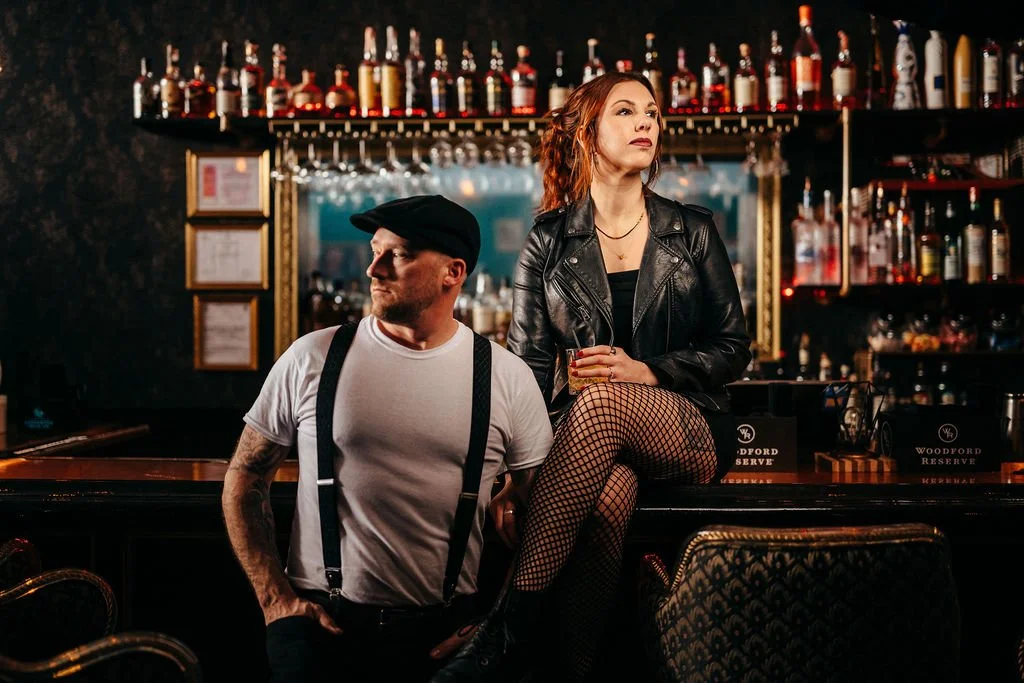 Moody portrait of Kristin and Mike at the bar, speakeasy engagement photography in Laconia NH