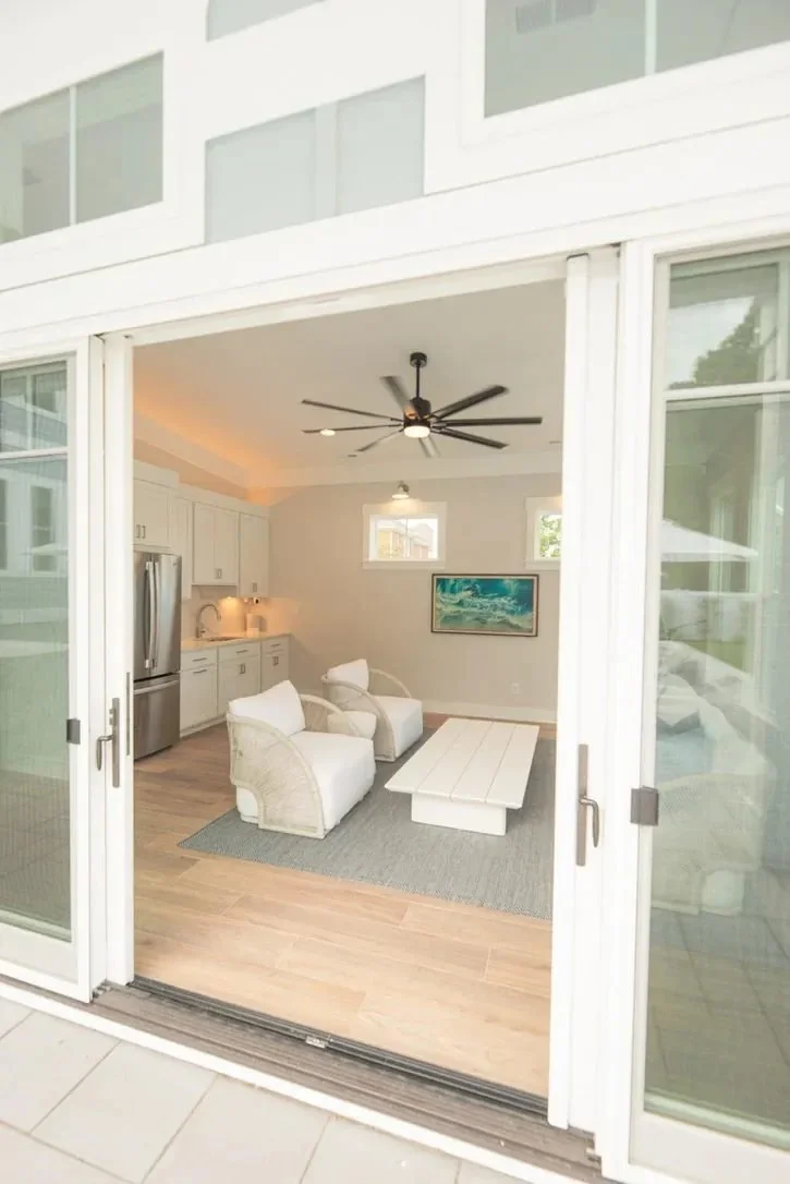 Craig's pool house interior through open doors