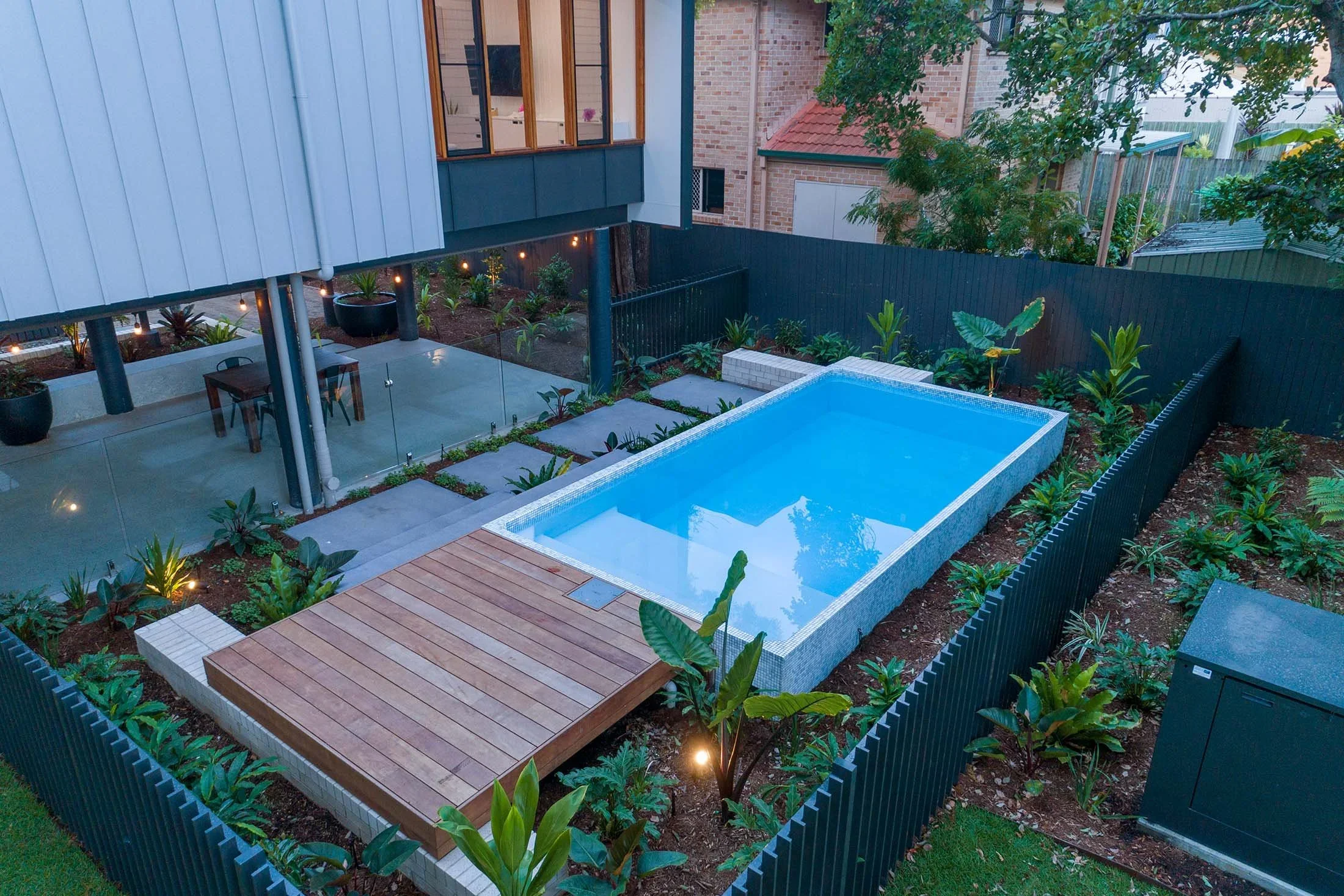 Resort-style pool and outdoor living space at dusk