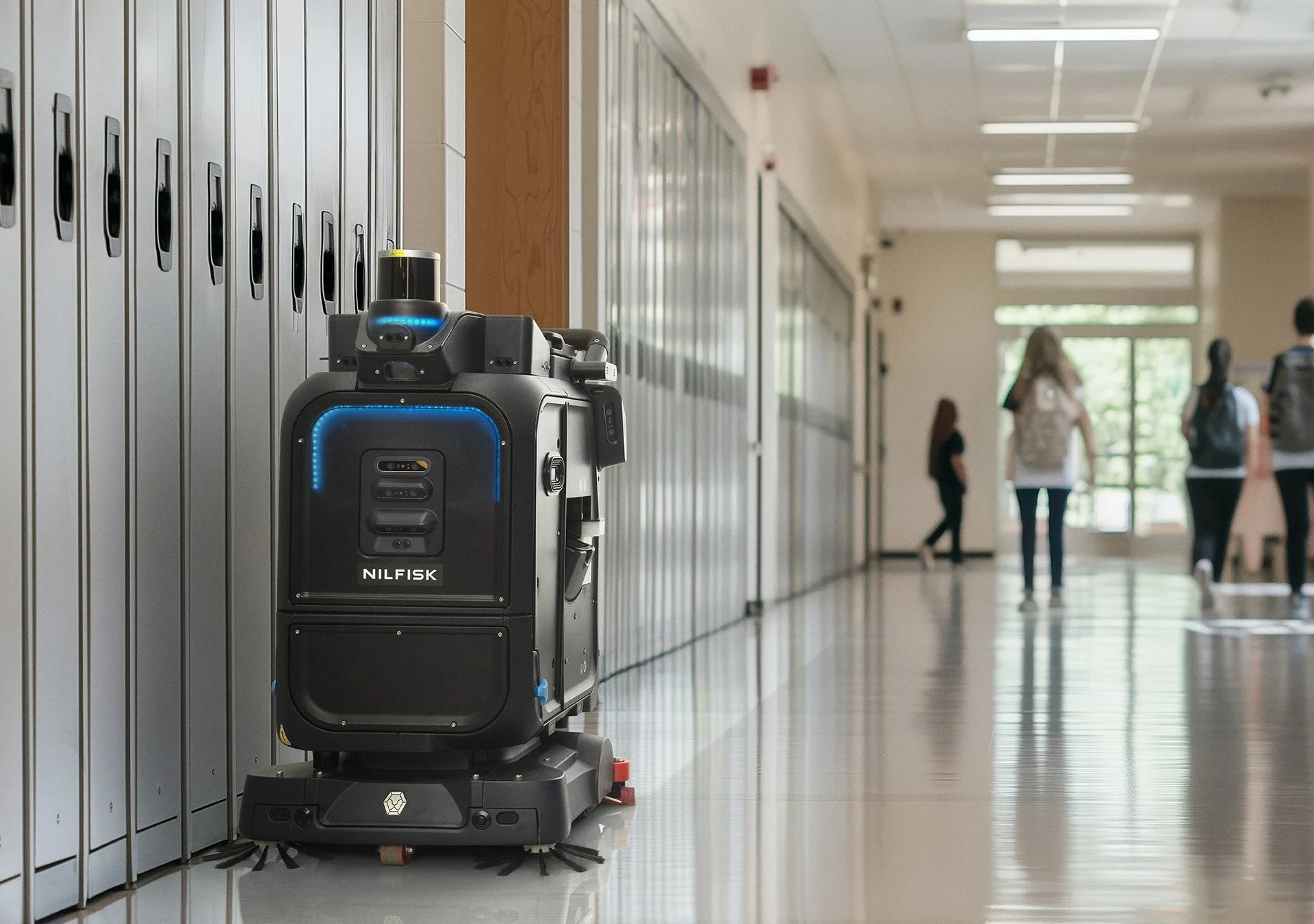 Nilfisk autonomous cleaning robot operating in a busy education environment
