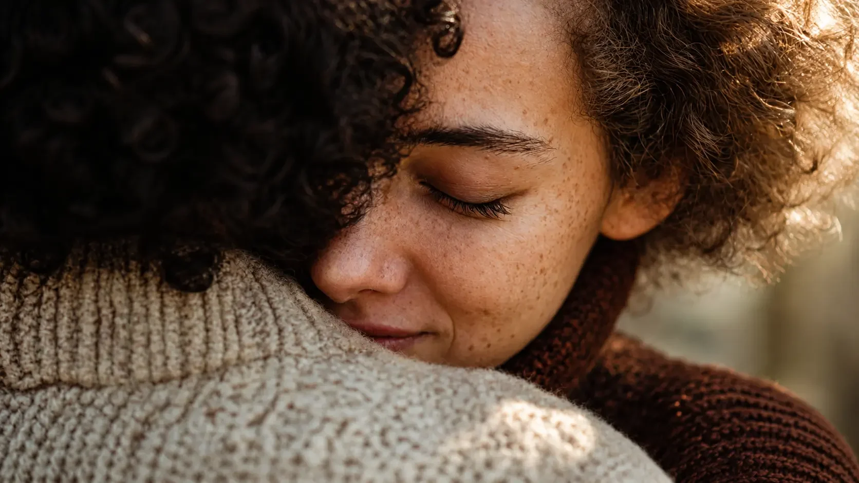 Warm close-up of two people embracing in an AI-created or modified campaign image by Scenes