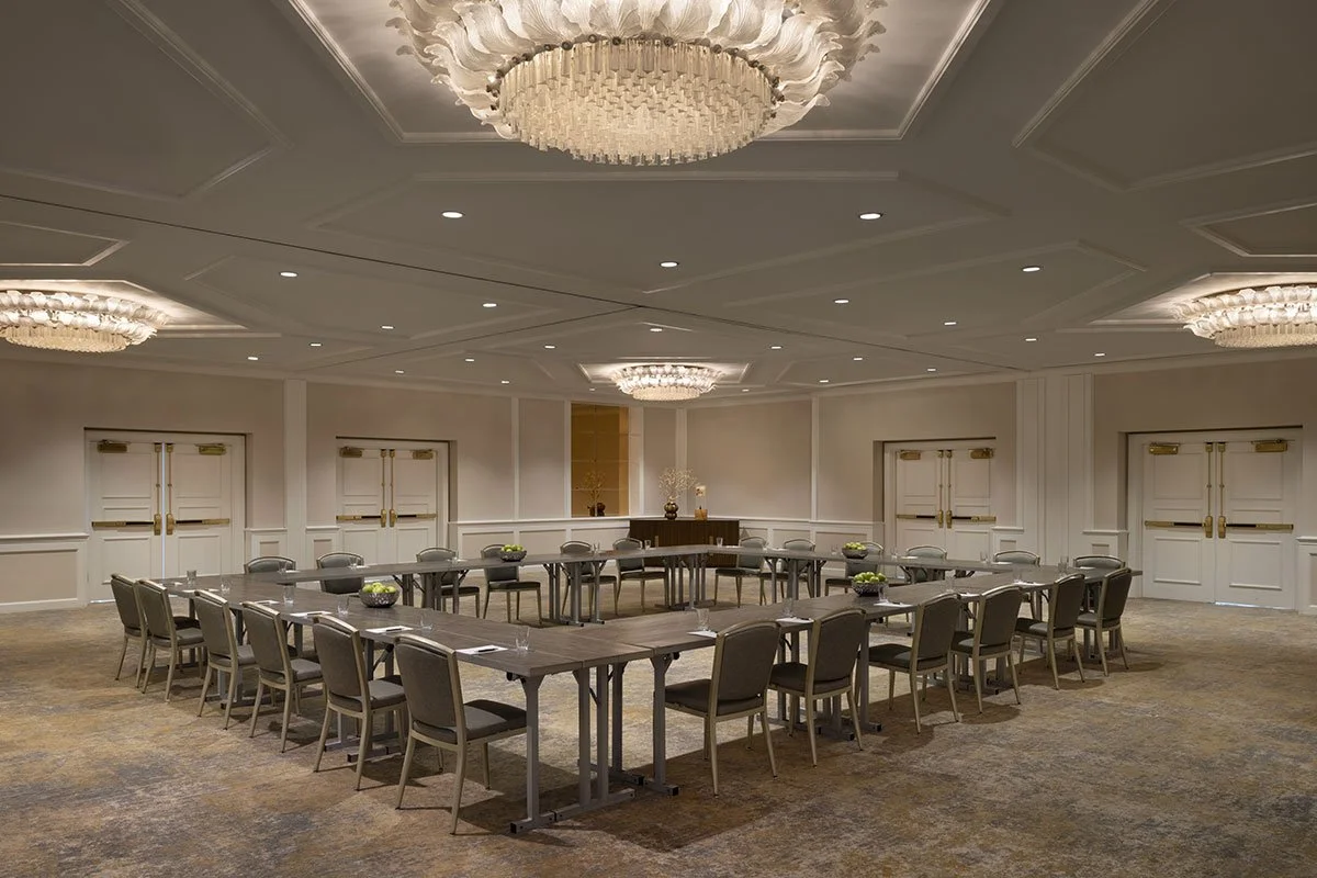 Meeting room with a hollow square table setup for a presentation.