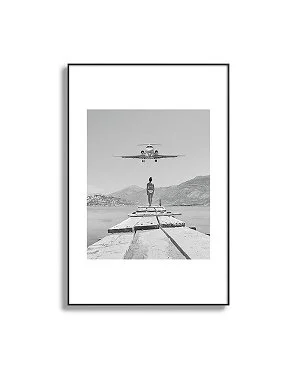 Steady As She Goes; aircraft coming in for an island landing black and white photography- photographs Framed Art Print