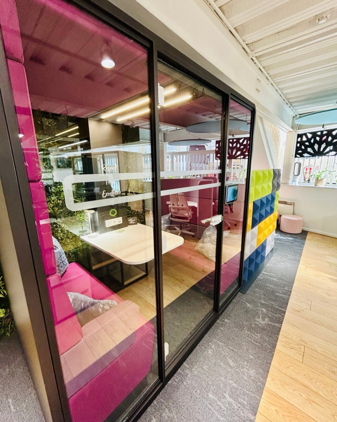 Exterior of the purple Mikomax HushMeet meeting pod at Chamber