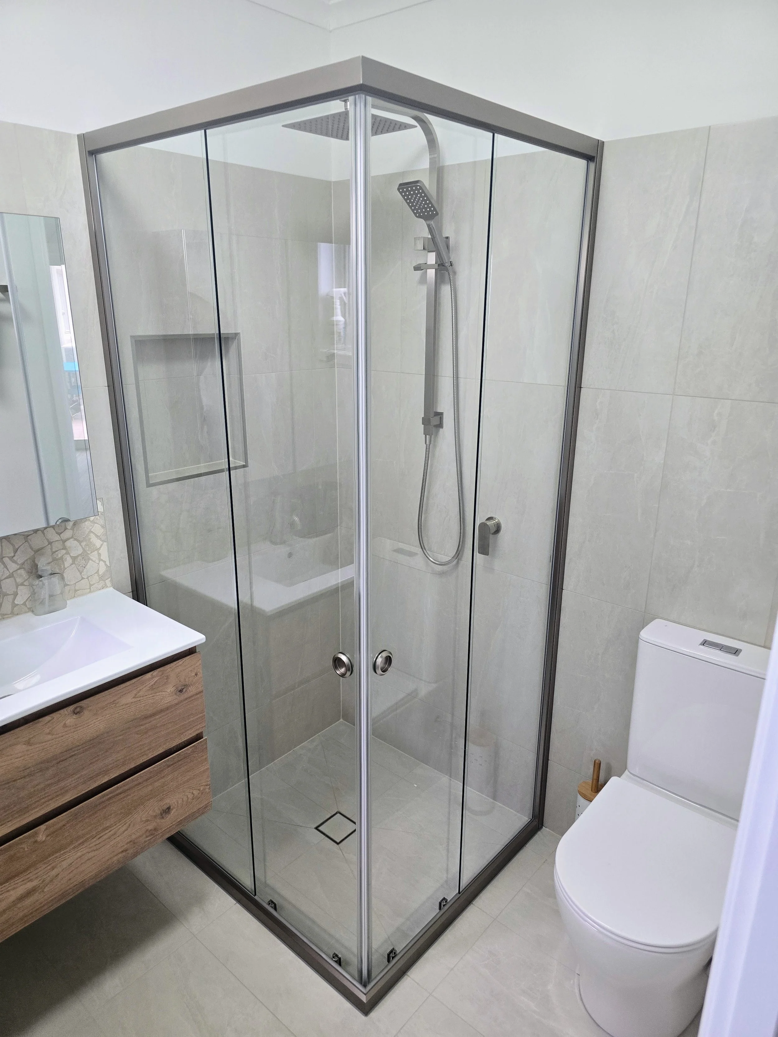 Two door corner entry semi frameless sliding shower screen closed
