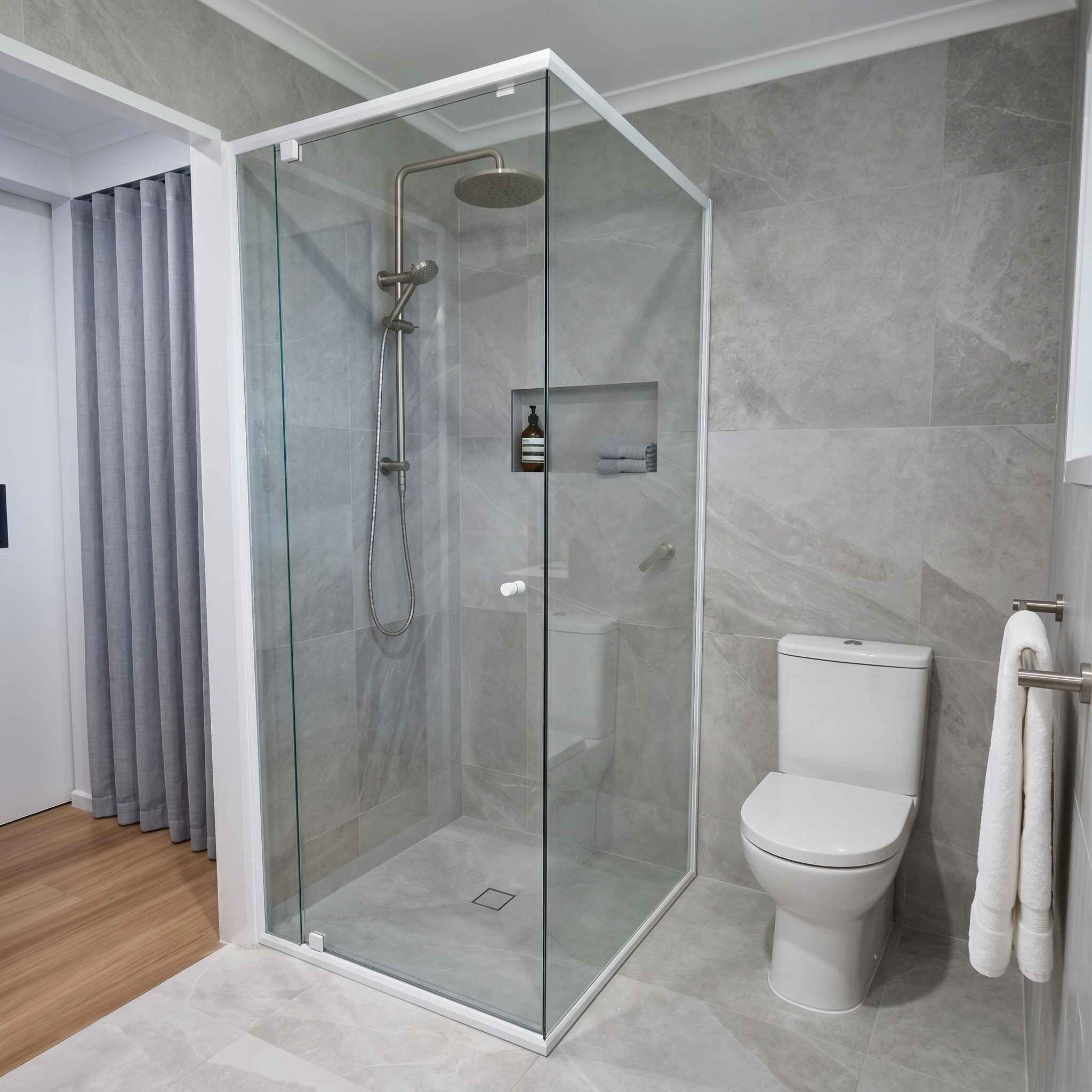 Semi-frameless sliding shower screen with smooth bypass panels in contemporary bathroom