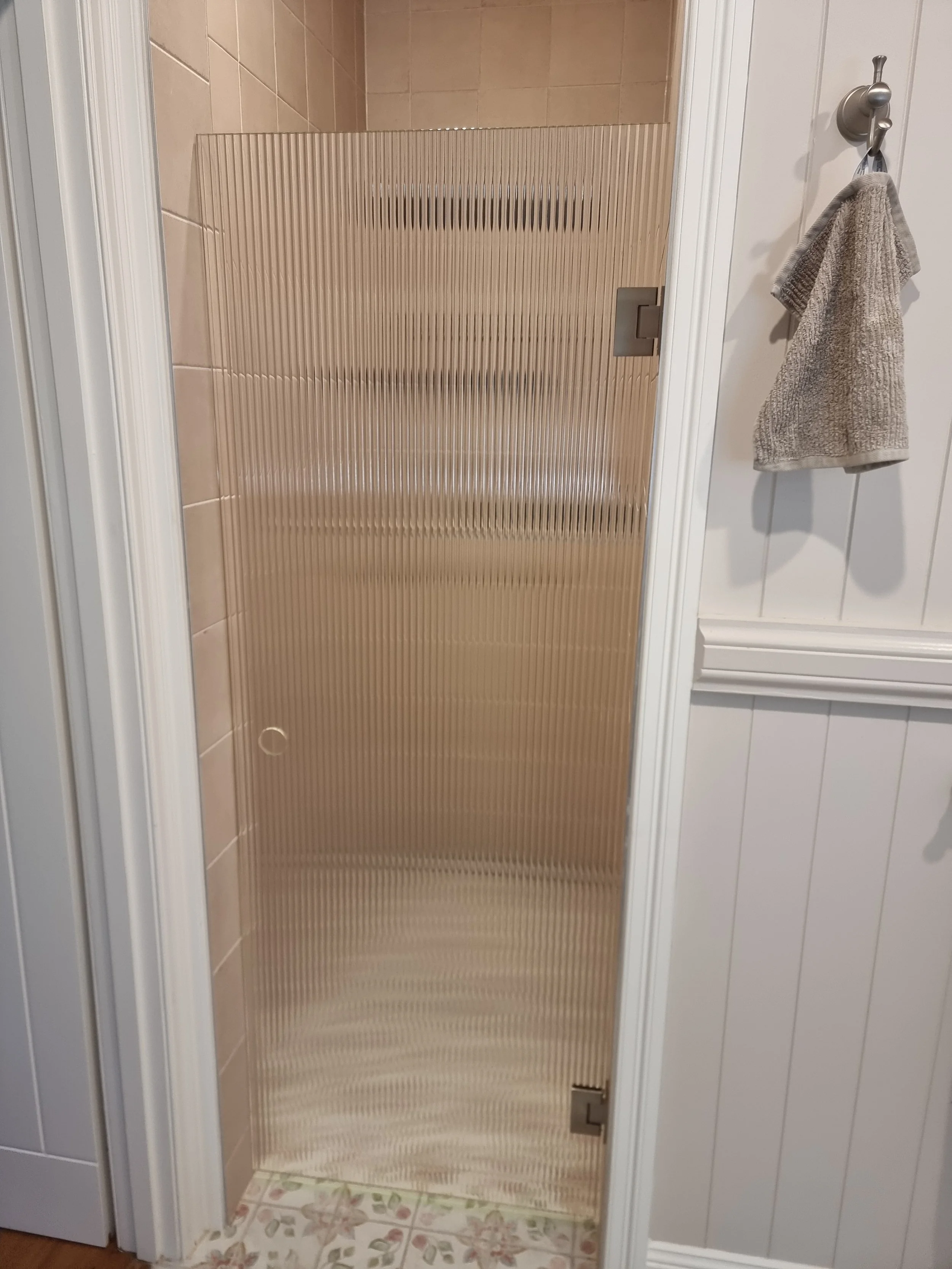 Low iron narrow reed fluted frameless shower screen