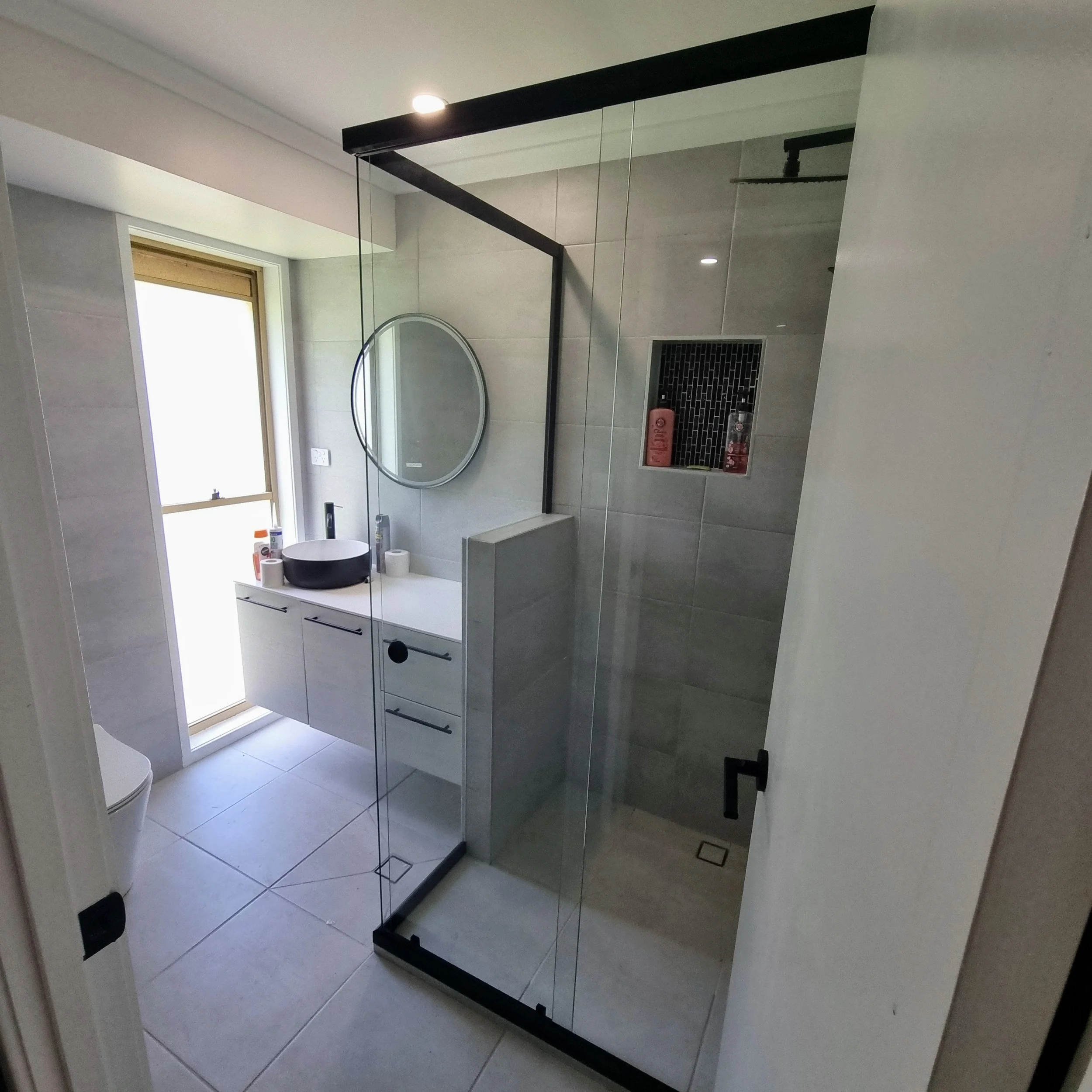 Semi frameless sliding shower screen installation