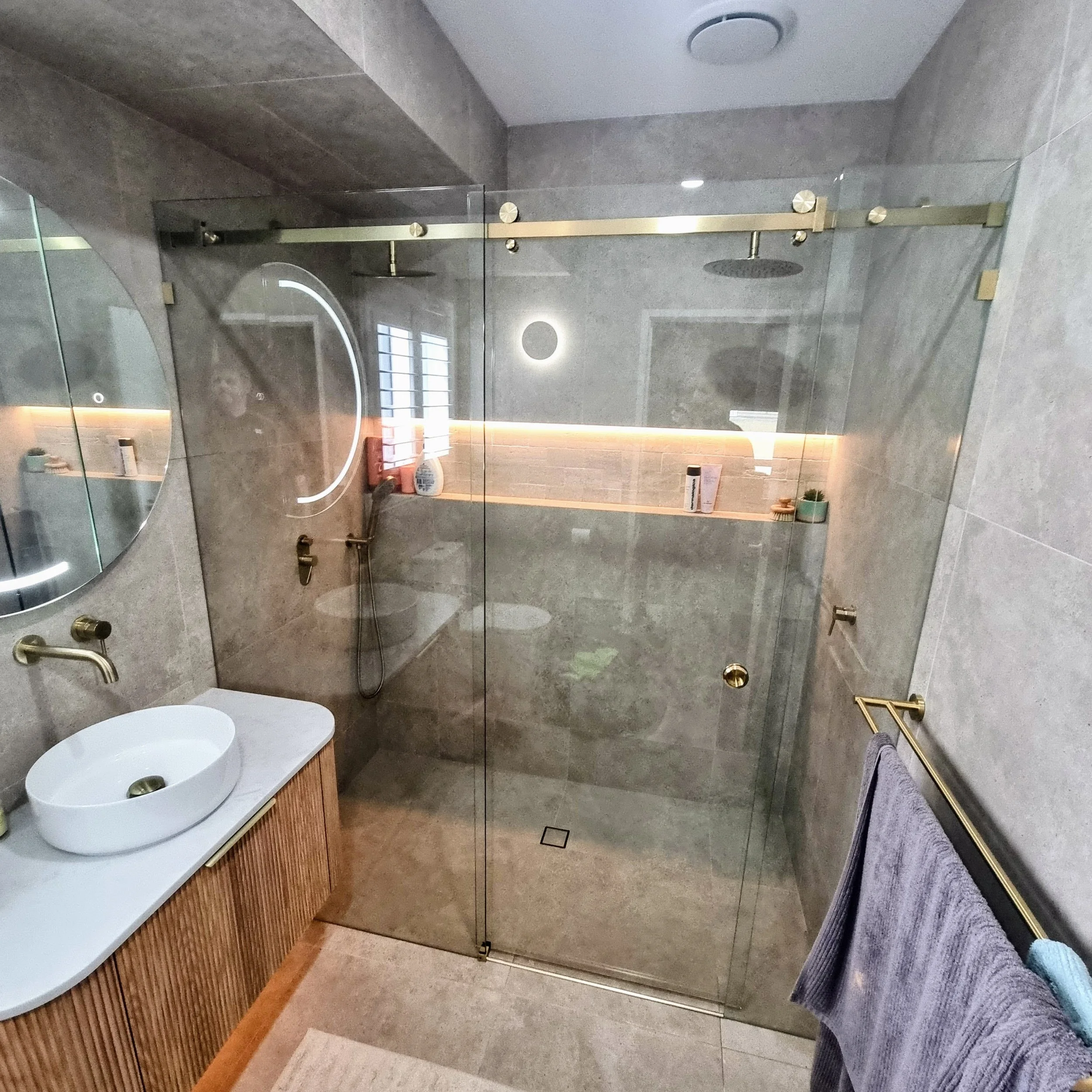 Frameless barn door style sliding shower screen on the Sunshine Coast