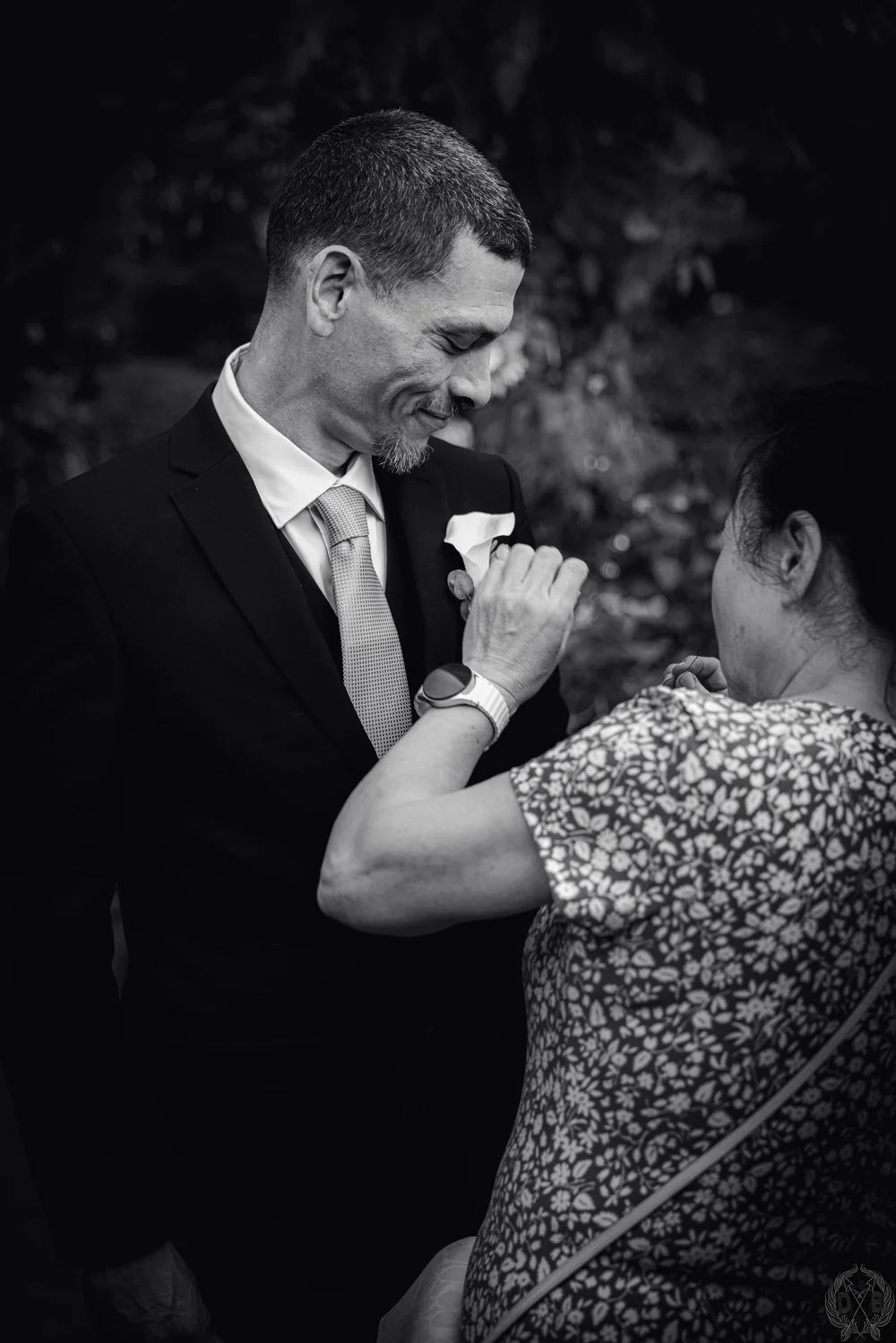Candid interaction photographed during a wedding or event