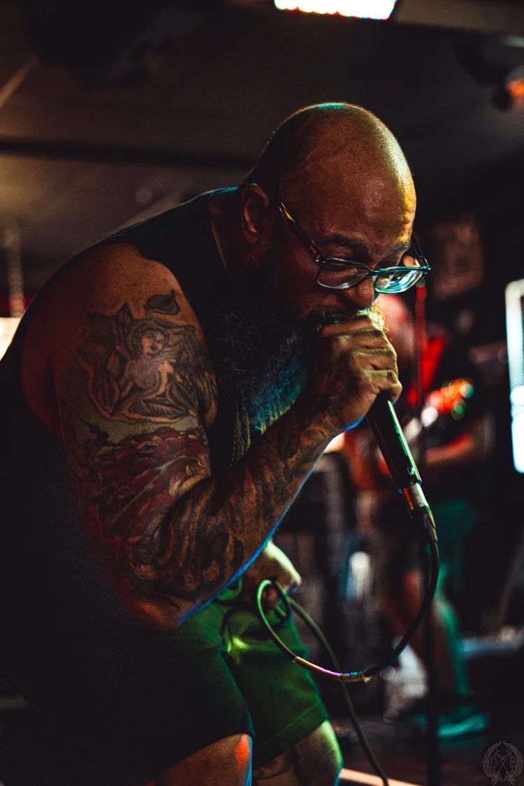 Chronepsis performing live under concert stage lighting