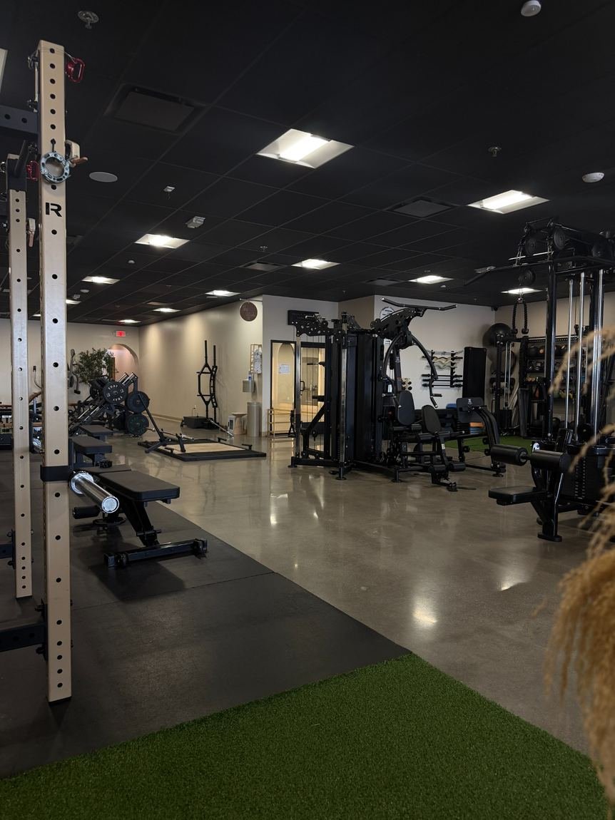 IronBody Studios gym-floor equipment where small-group coaching takes place