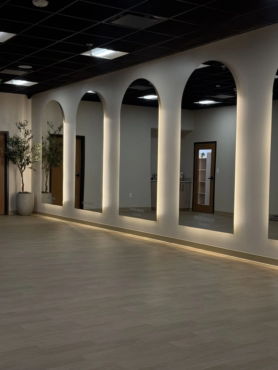 IronBody Studios actual Pilates and yoga studio with arched mirrors