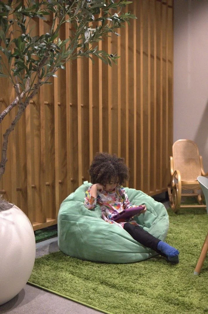 Child enjoying the IronBody Studios kids lounge
