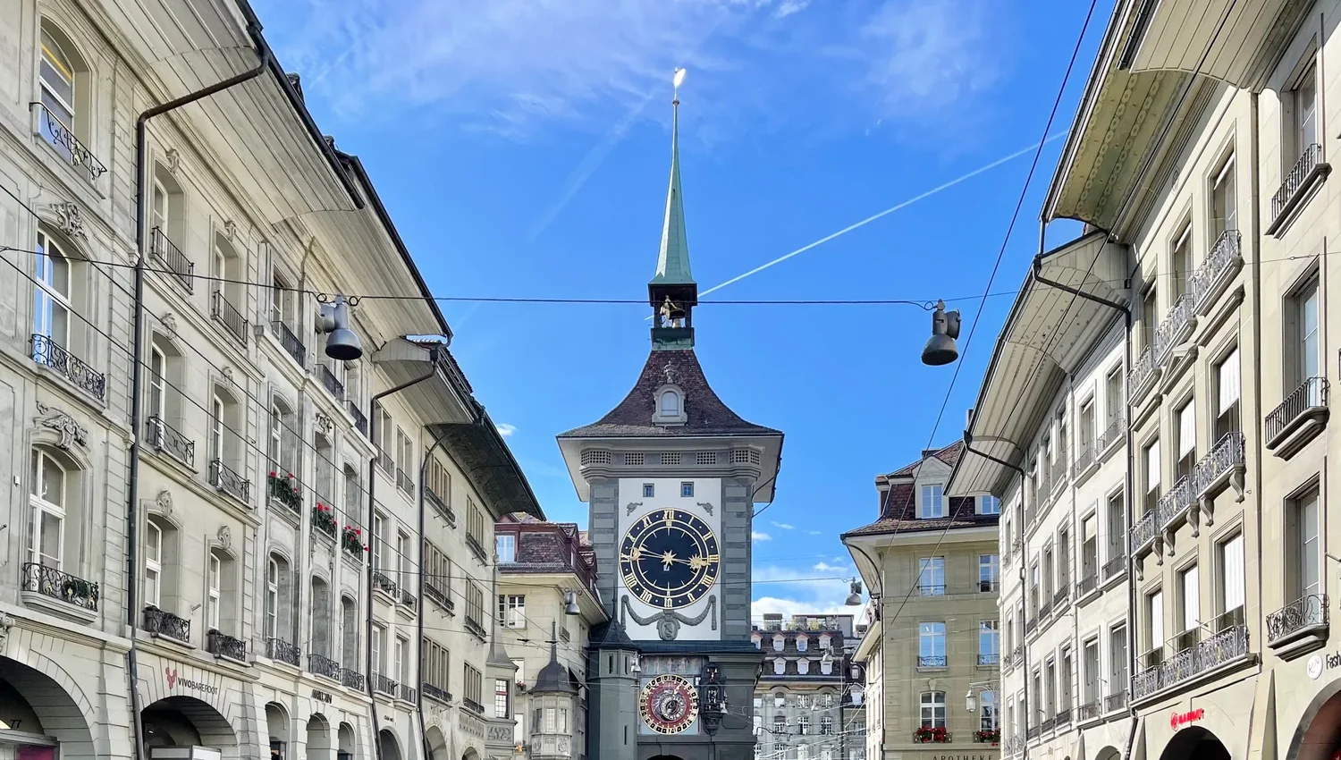 The Zytglogge clock tower in Bern's old town with sandstone façades and arcades