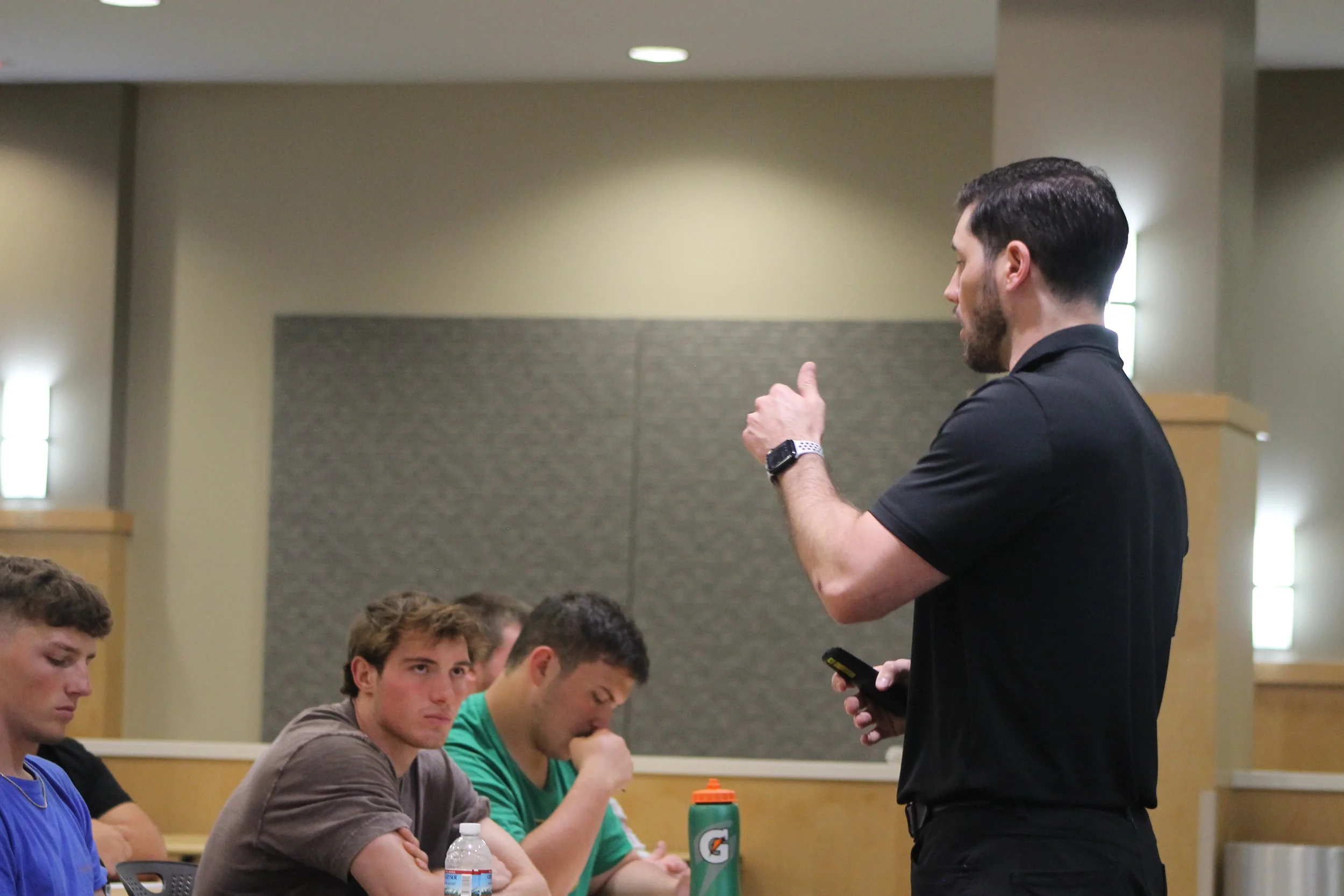 Coach Dom Clegg coaching athletes during an A1pha Pack session
