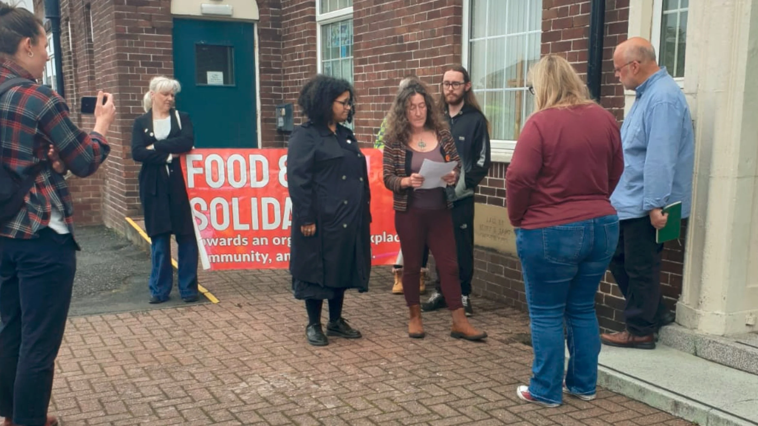 Food and Solidarity members and Grace outside Newcastle County Court during her Section 21 eviction case, with the community Eviction Support Group present