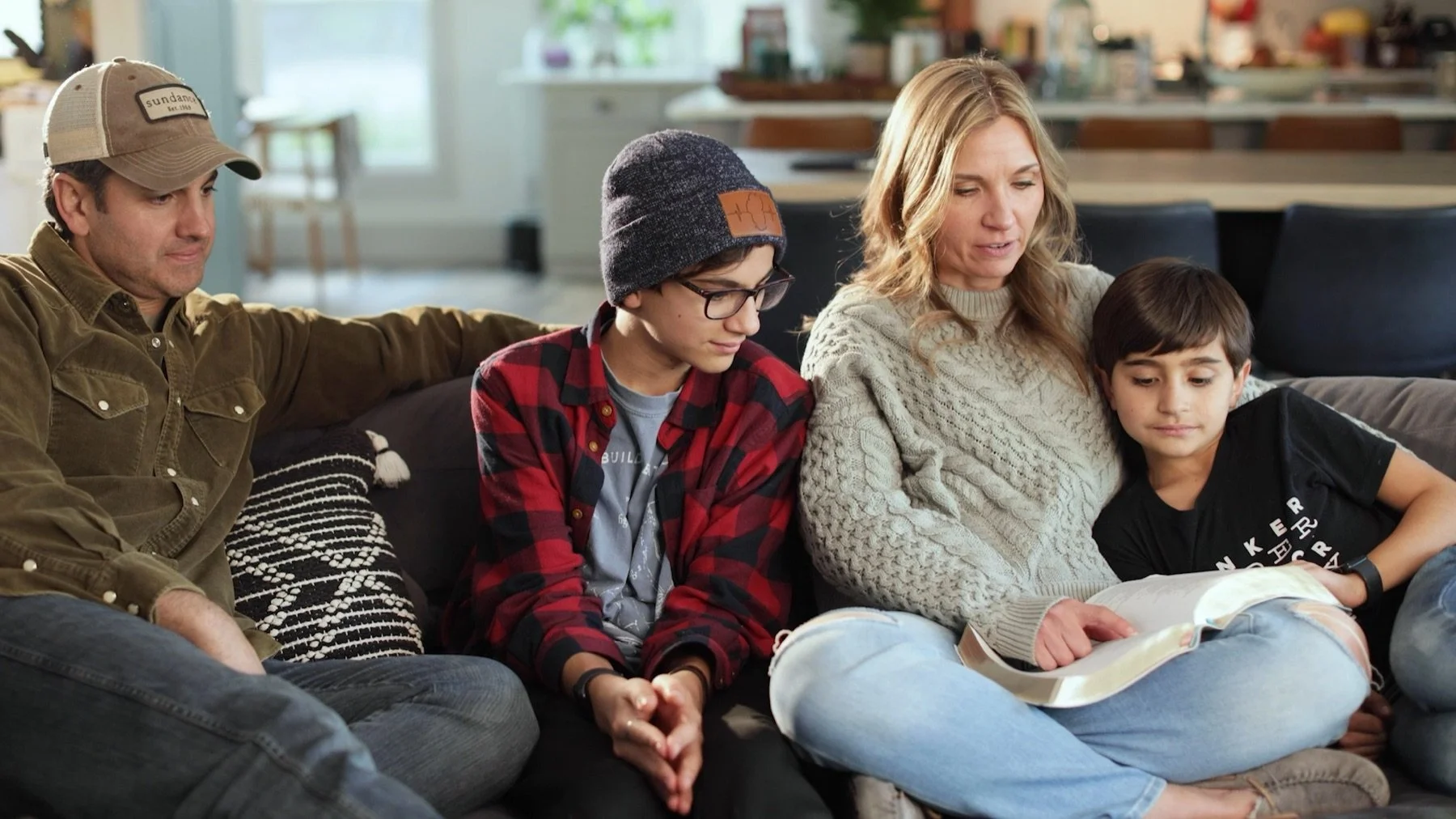 A family reading and learning together at home