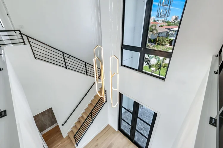 Two-story foyer with an open stair to the upper level.
