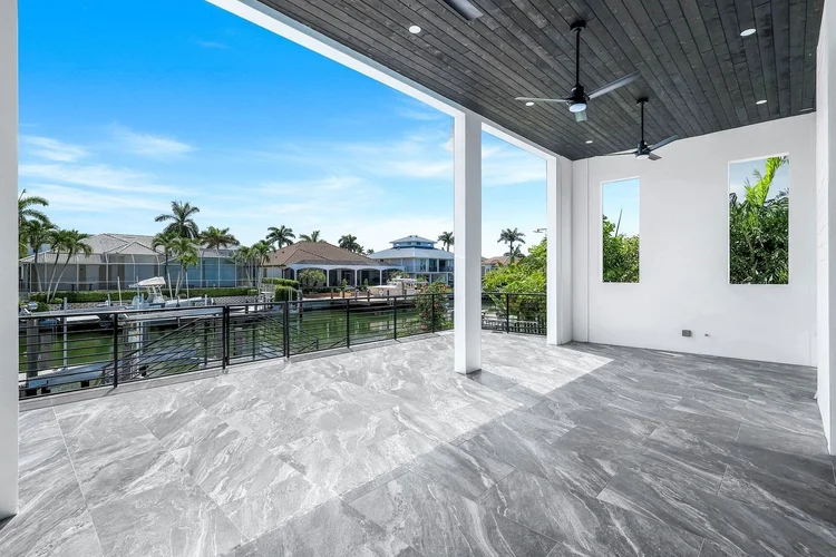 One of three covered balconies, over the lanai and facing the canal.