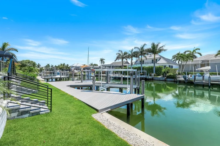 Seawall, dock and boat lift, with direct access to the Gulf.