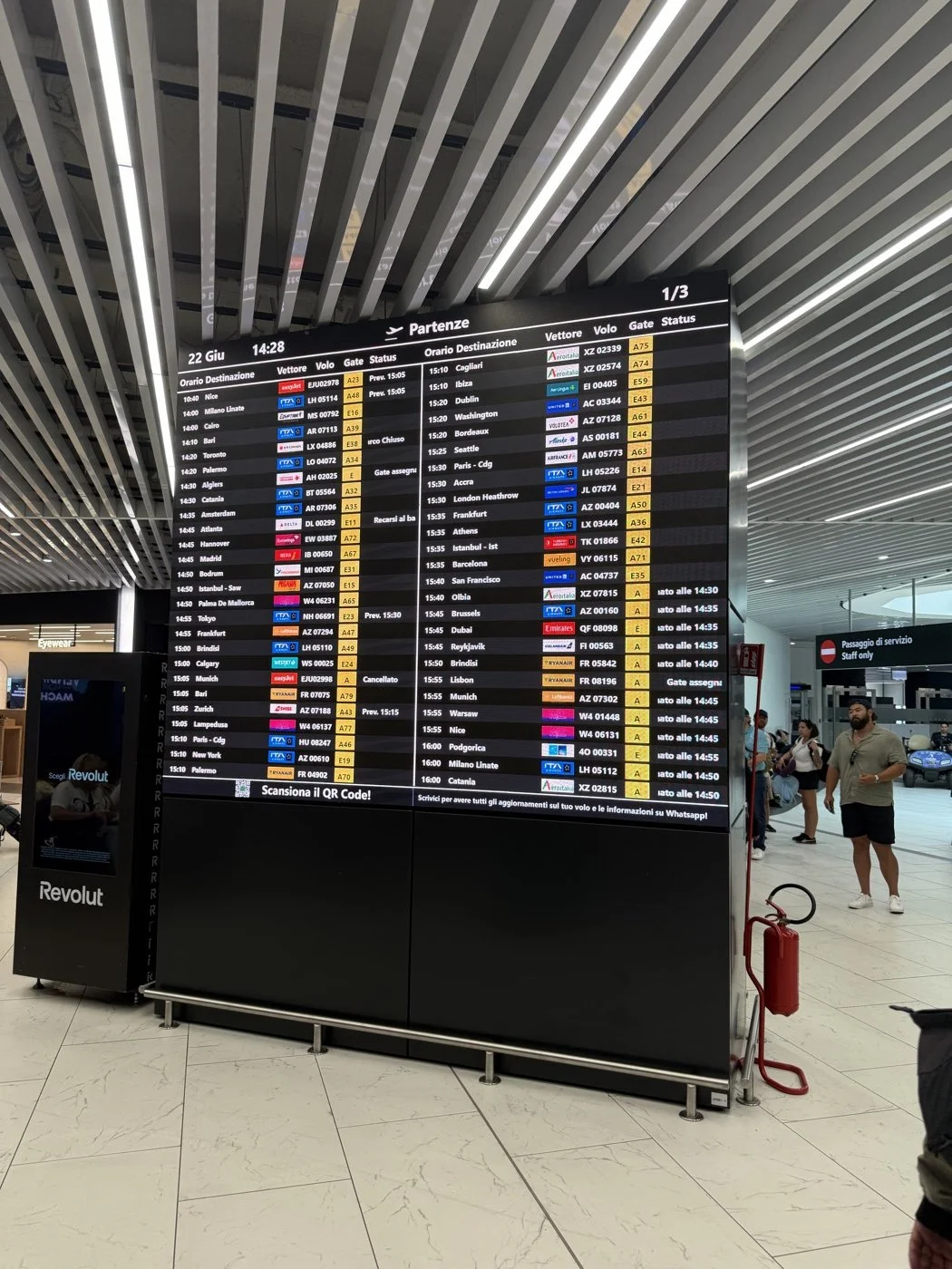 The departure board at Rome Fiumicino, June 22, 2026: the only instantly readable things on it are the airline logos