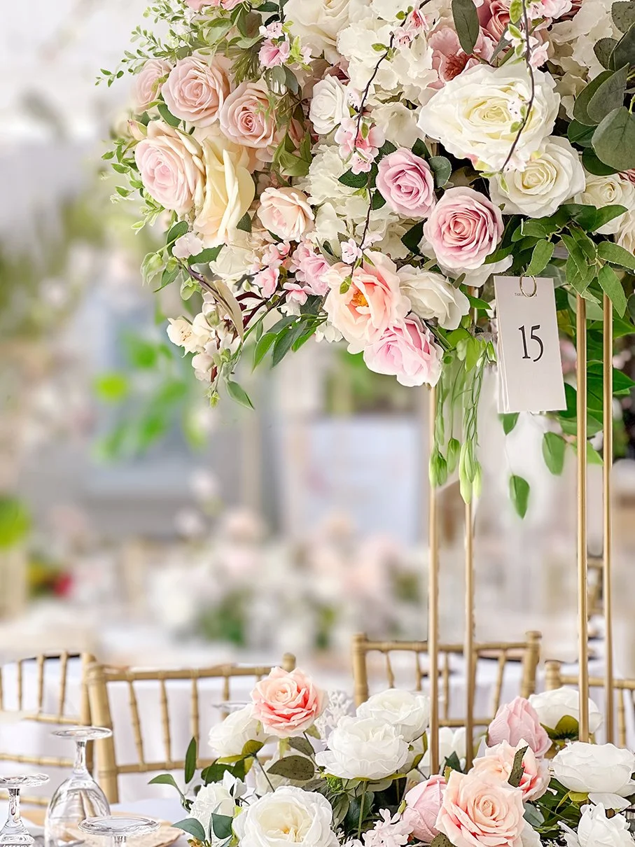 Blush pink and ivory floral arrangement with roses, white hydrangeas, greenery and delicate garden-inspired blossoms for an outdoor engagement celebration.
