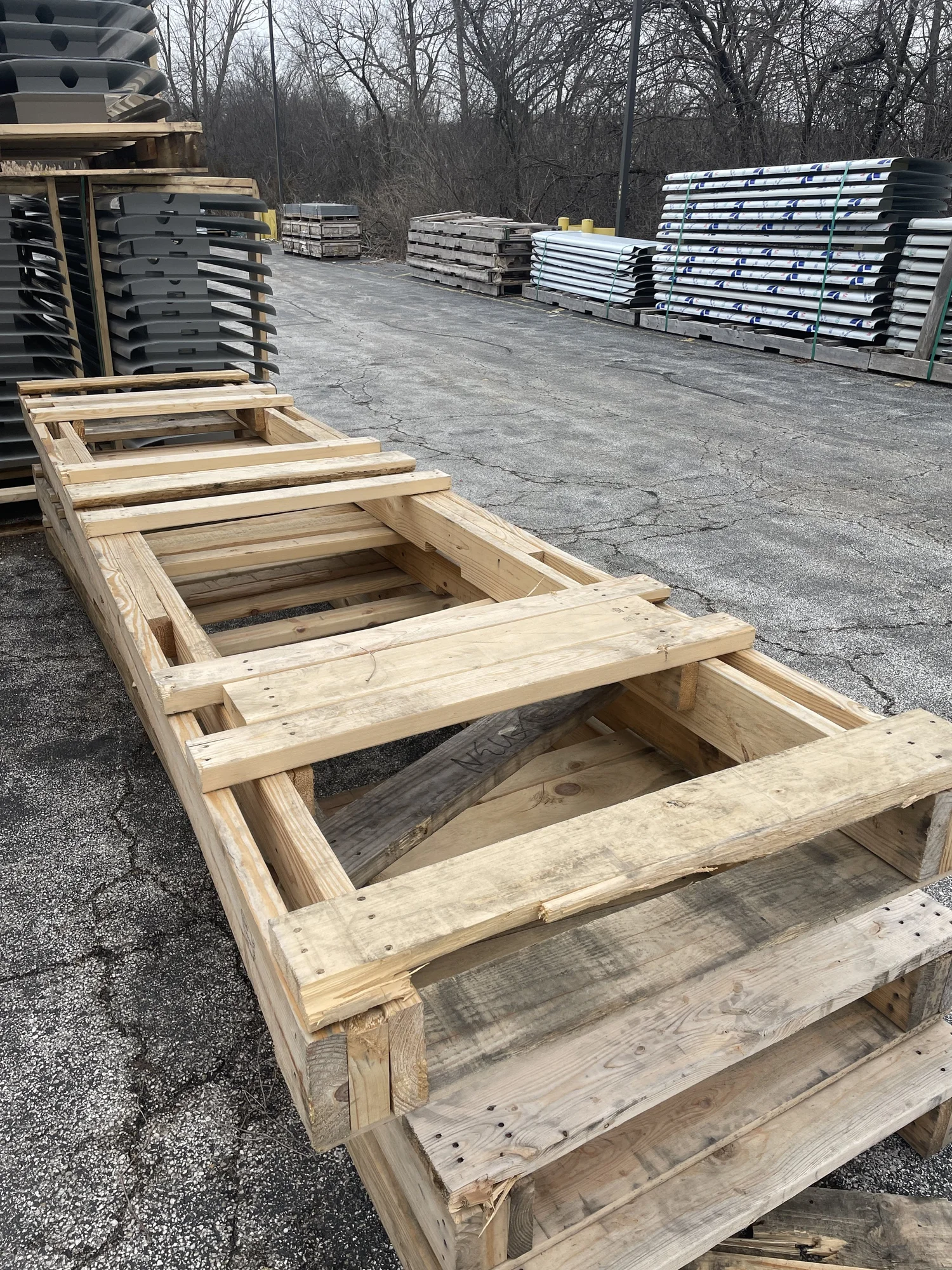A 96 by 36 heavy duty custom pallet with four 2x6 stringers and side slots for sidewall dunnage