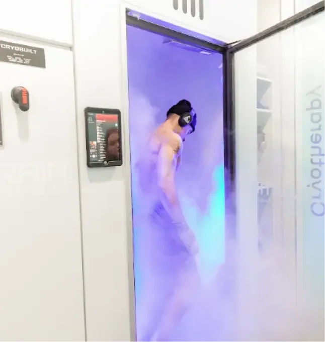 Client using a whole body cryotherapy chamber at Huemn Houston