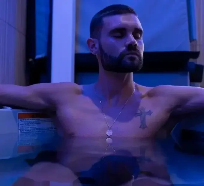 Man in a cold plunge tub at Huemn Houston