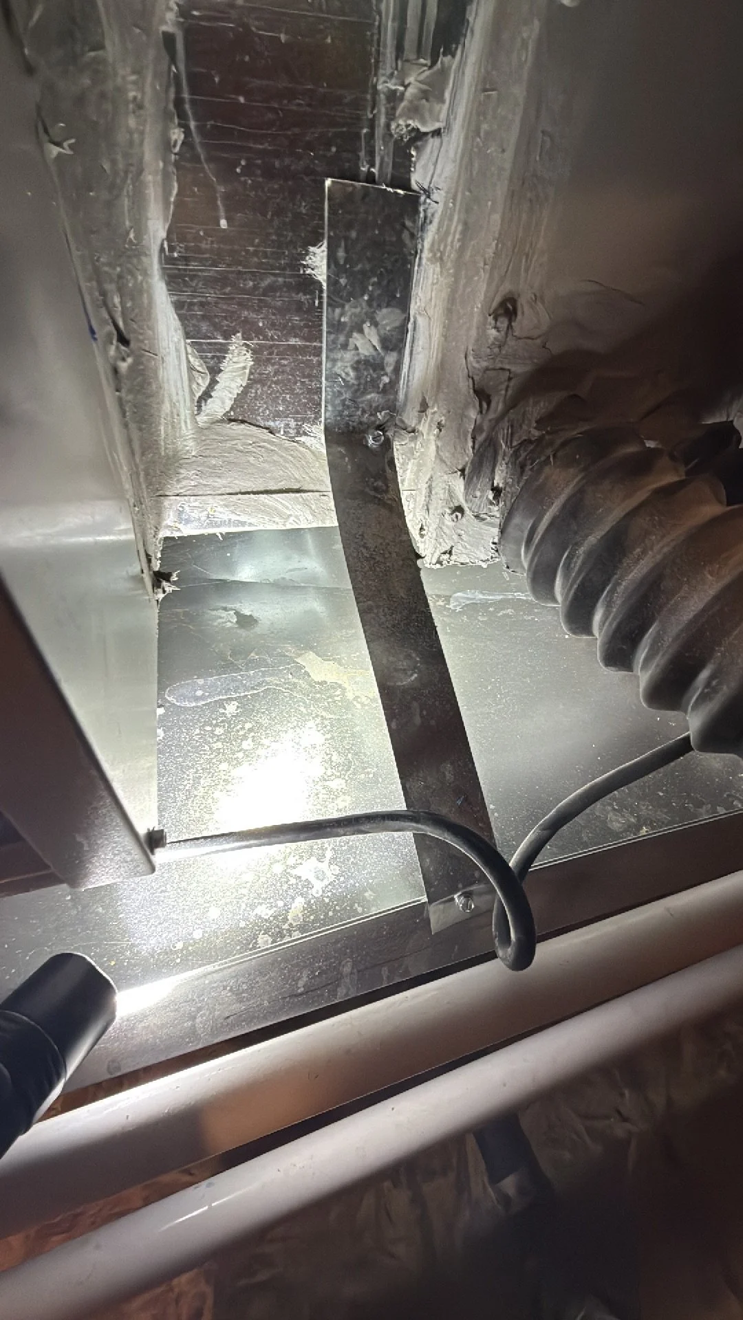 Another view of water stains in an HVAC catch pan