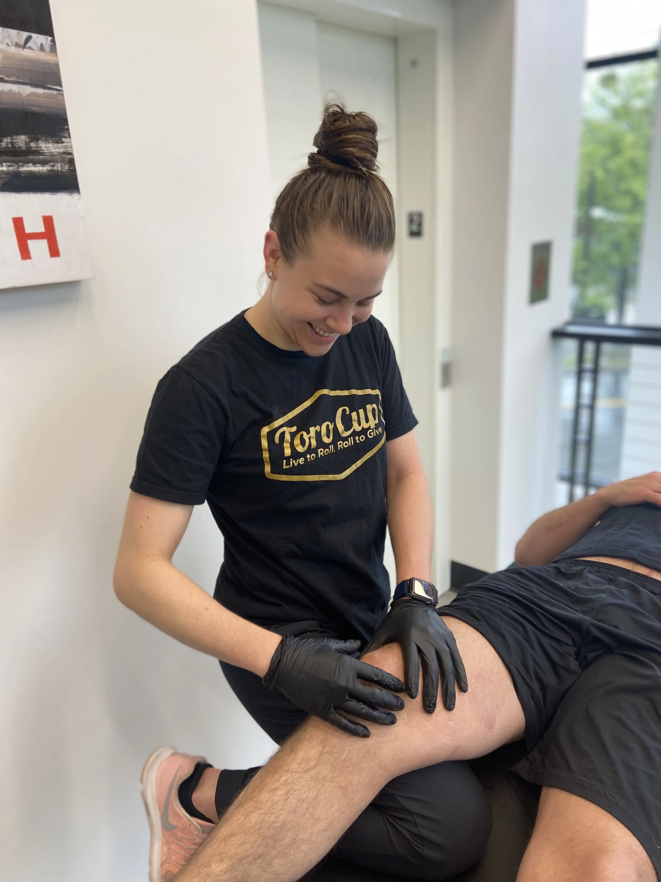 Physical therapist working with an athlete during a physical therapy session