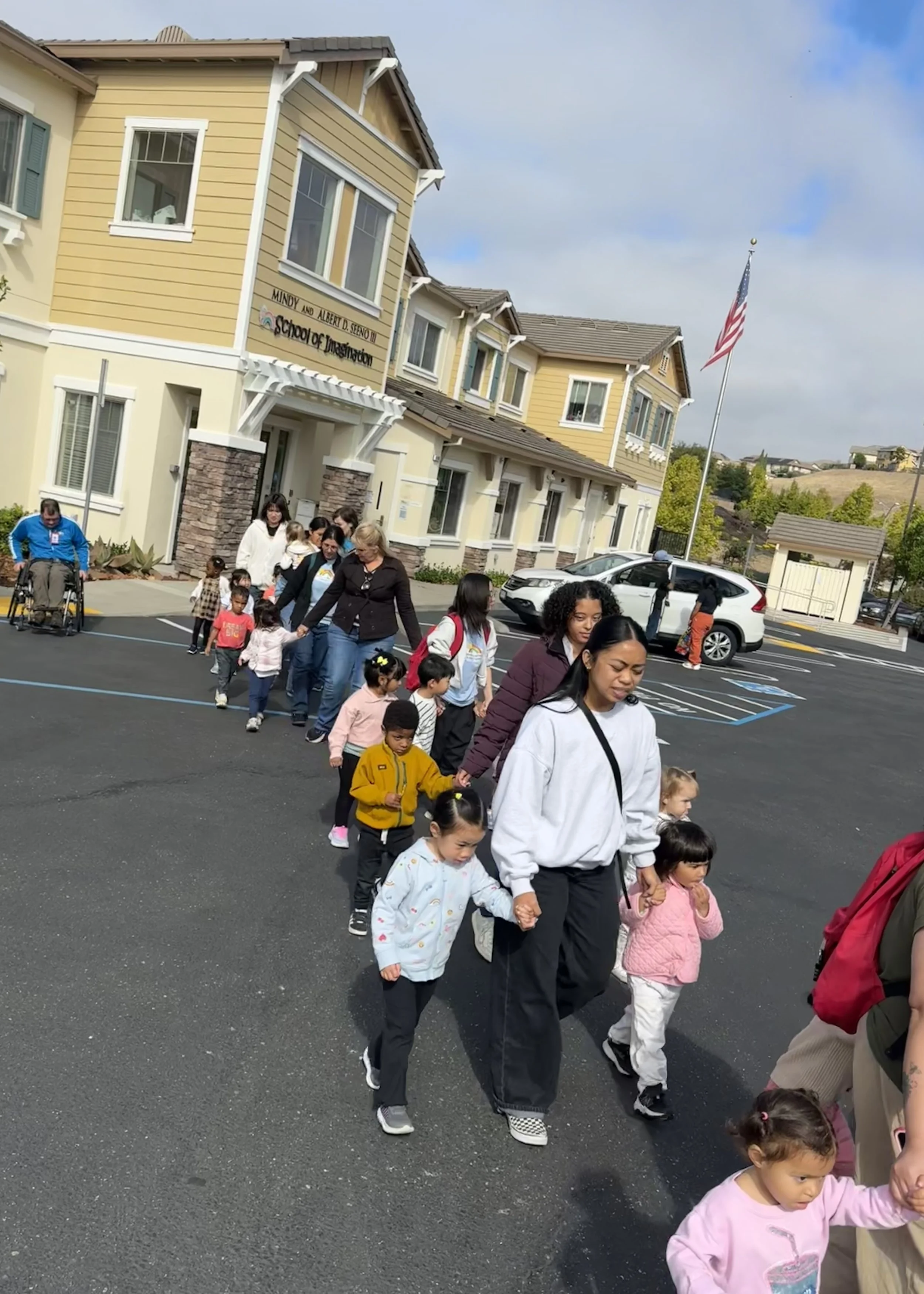 Classes evacuating in front of School of Imagination during the fire drill