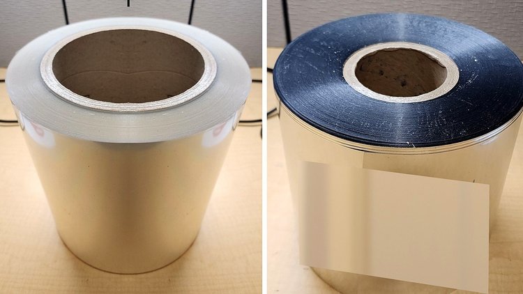 Rolls of adhesive-backed industrial film