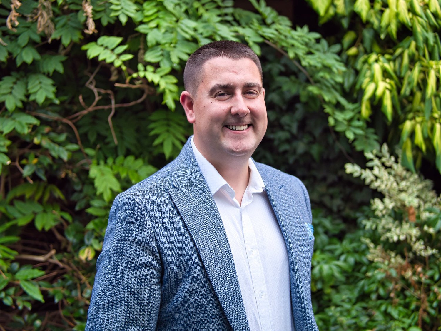 Karl Nicholson outdoors in a blue jacket