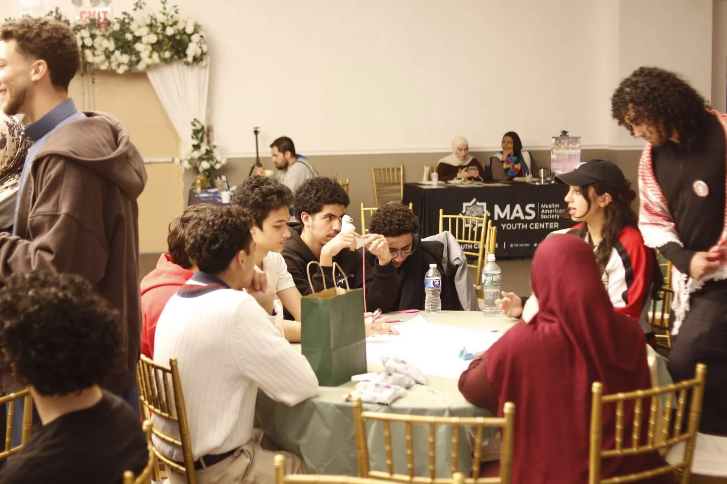 A table of students working through the planning workshop