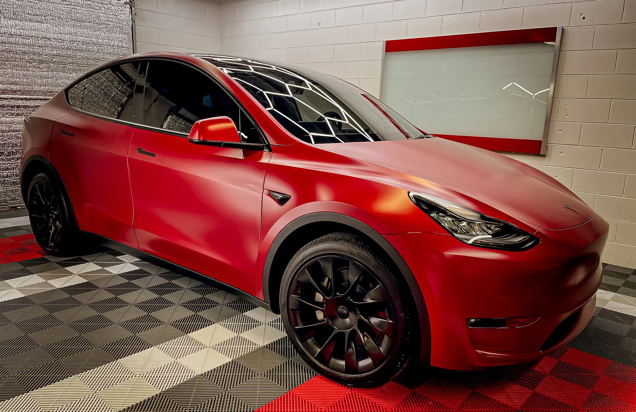 Finished red Tesla after vehicle protection service