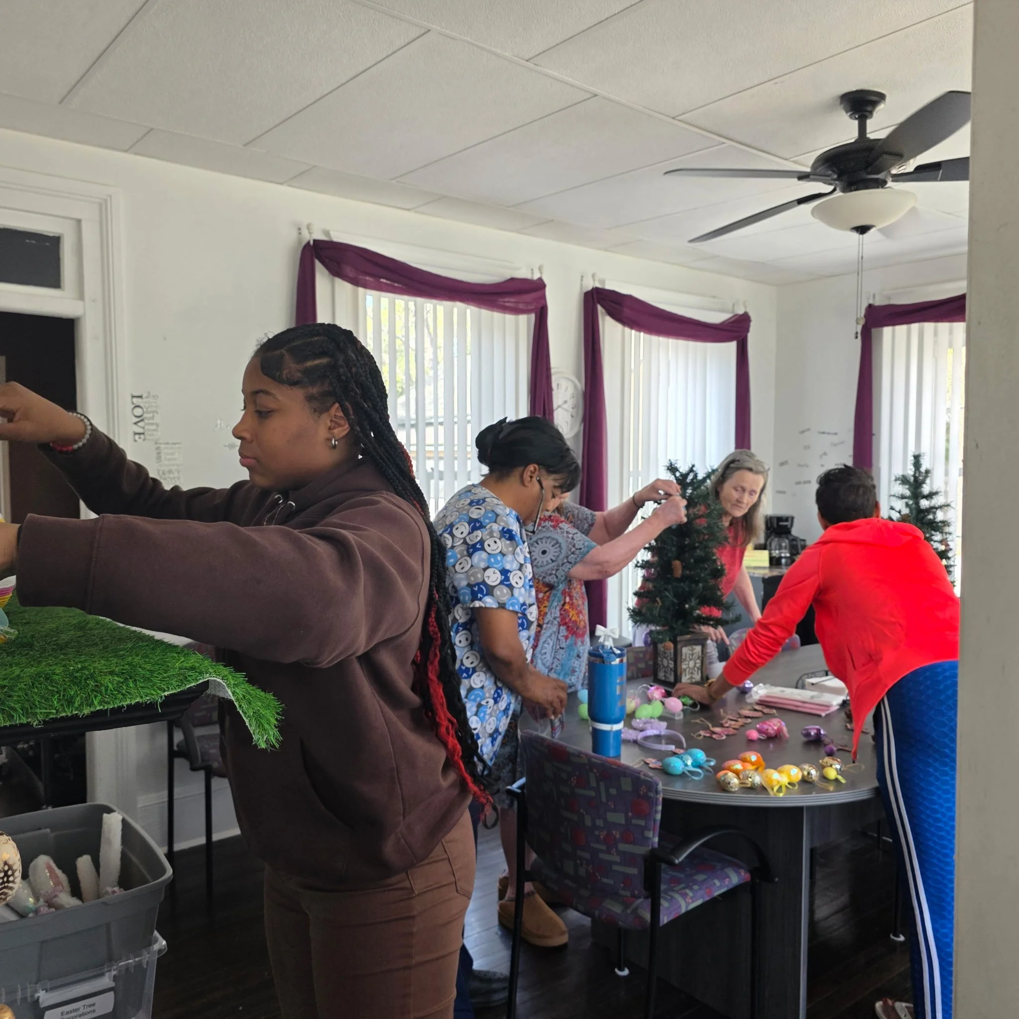 Youth working on Easter centerpiece preparations at Doc Hill's